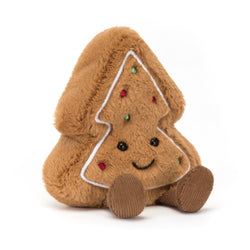 Plush gingerbread cookie toy with a smiling face on a white background