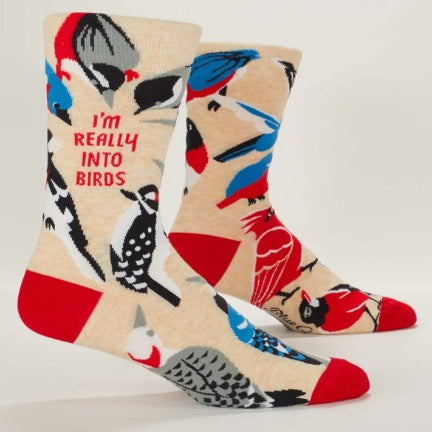 Colorful socks with bird designs and text on a beige background