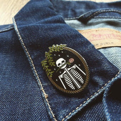 Skeleton enamel pin